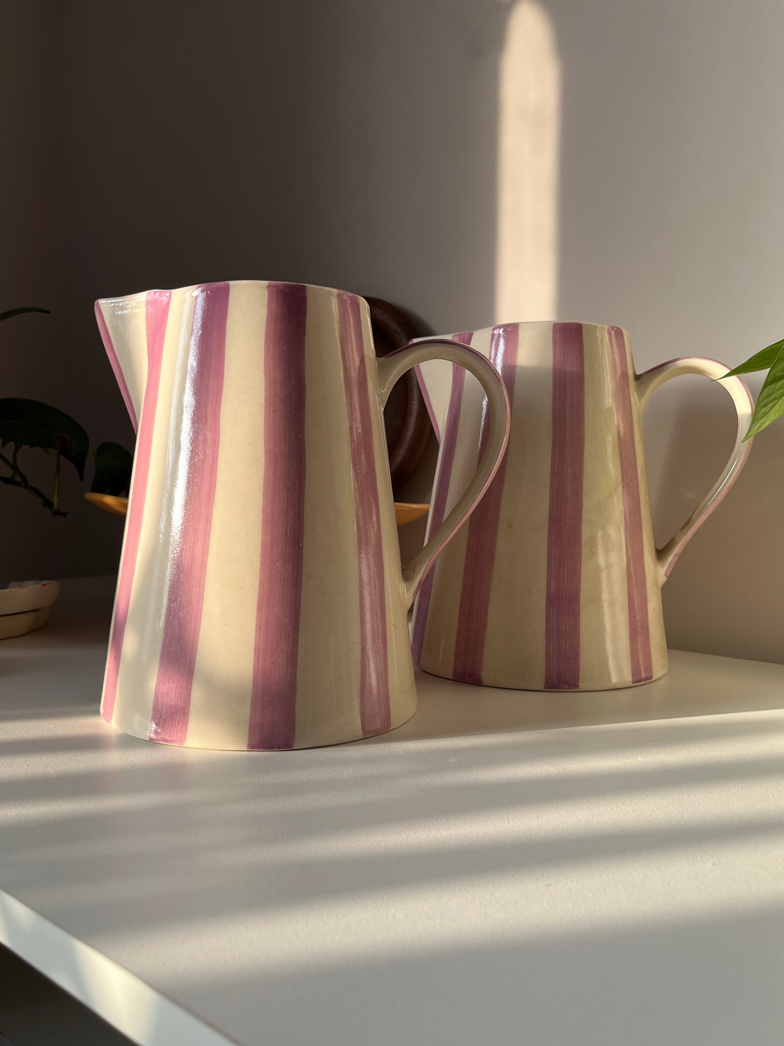 Two striped jugs/vases with purple stripes. Perfect for water pour and/or as a flower vase