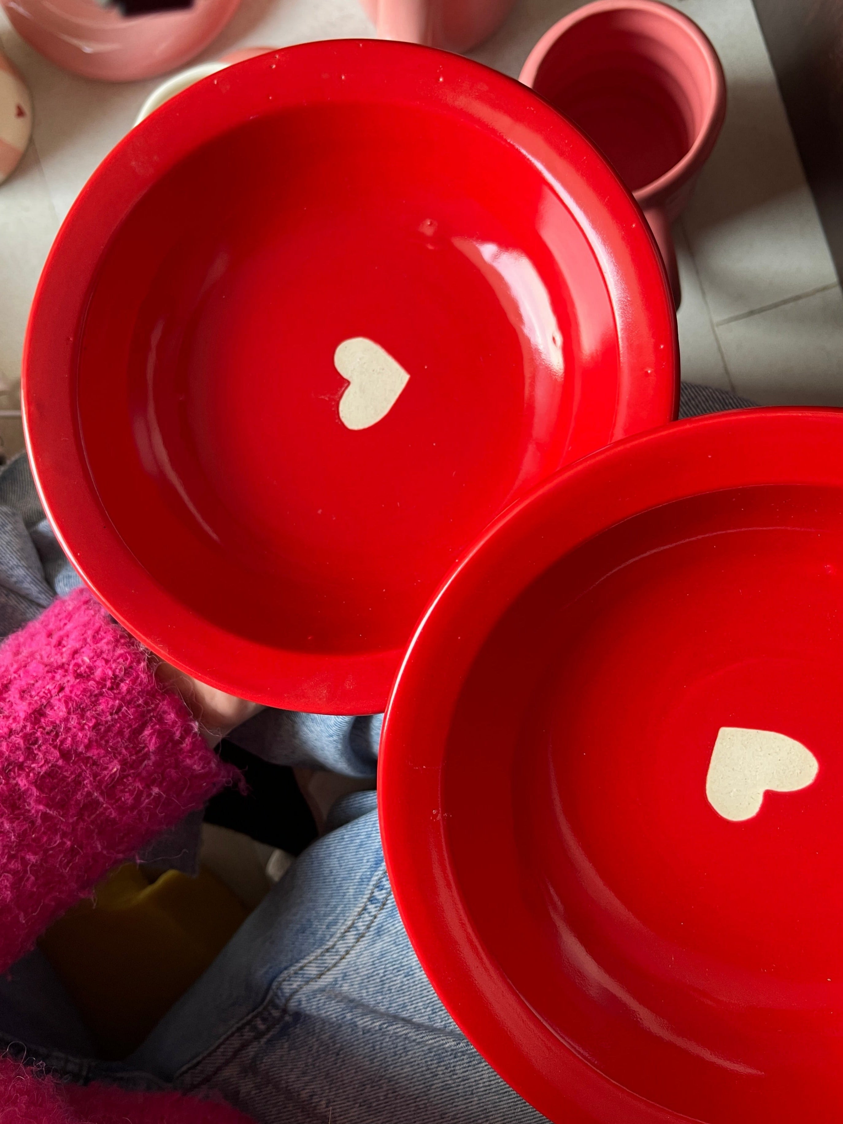 Red pasta fruit plate with white matte heart in the center. 