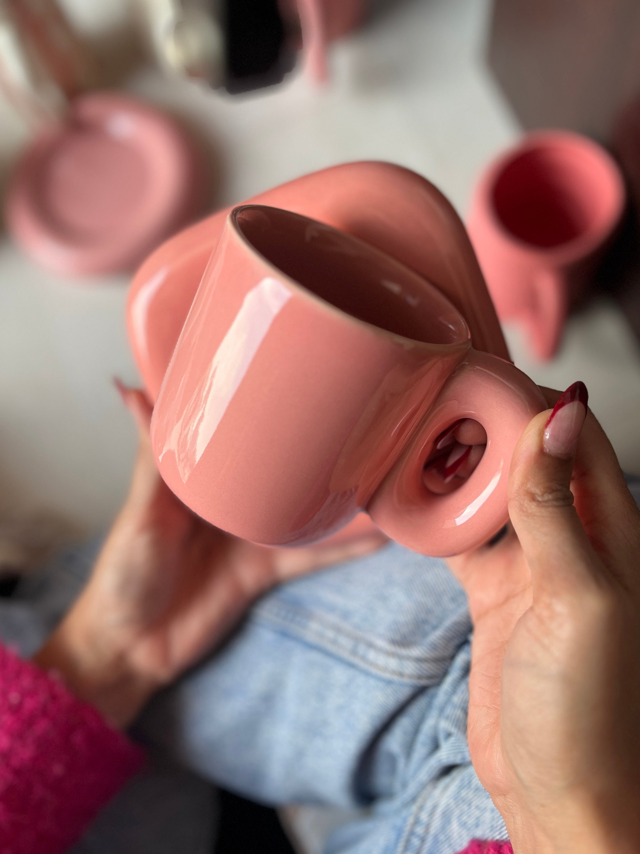 Solid pink ceramic mug with a square saucer