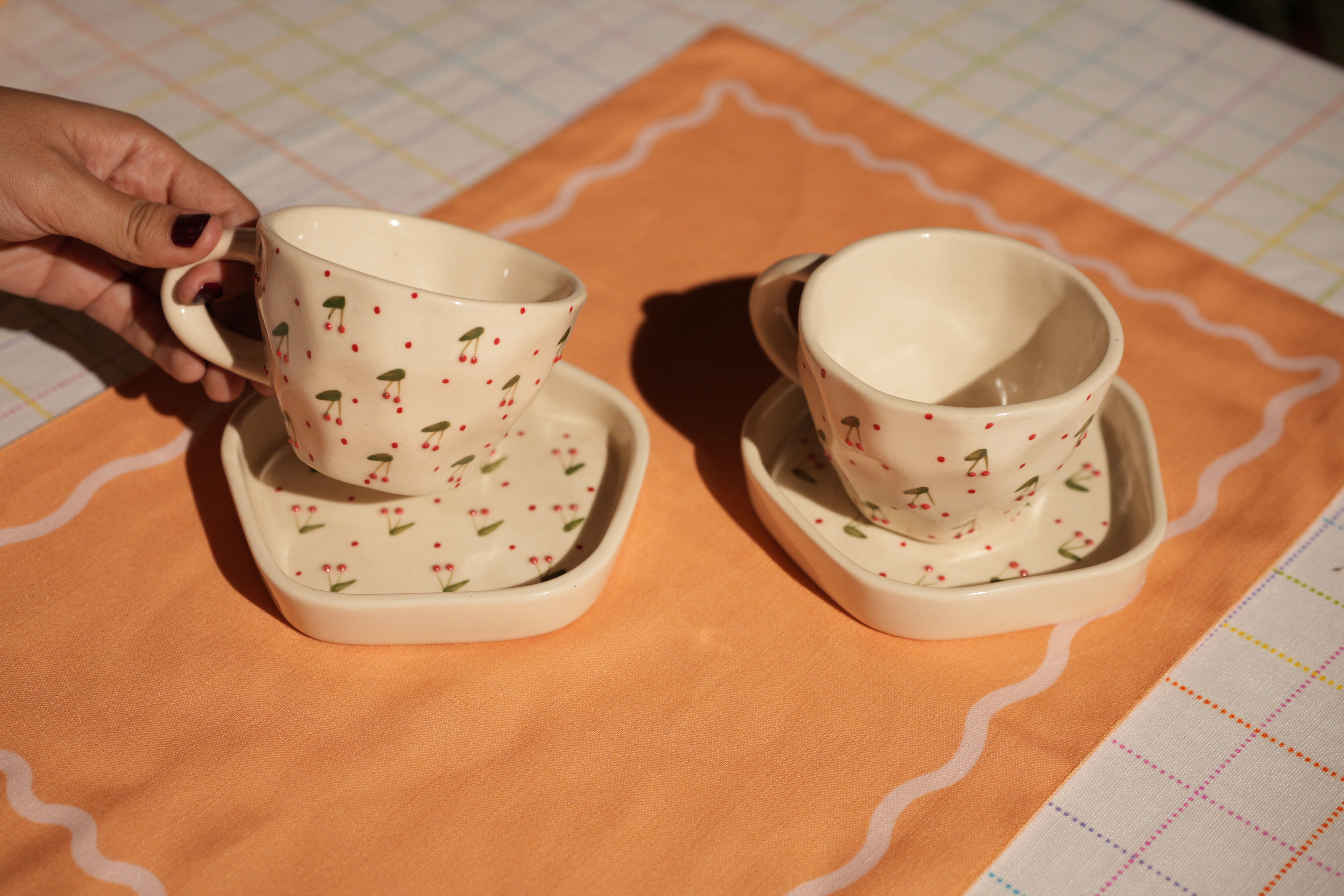 Ceramic cup and saucer with 3D cherry embellishments