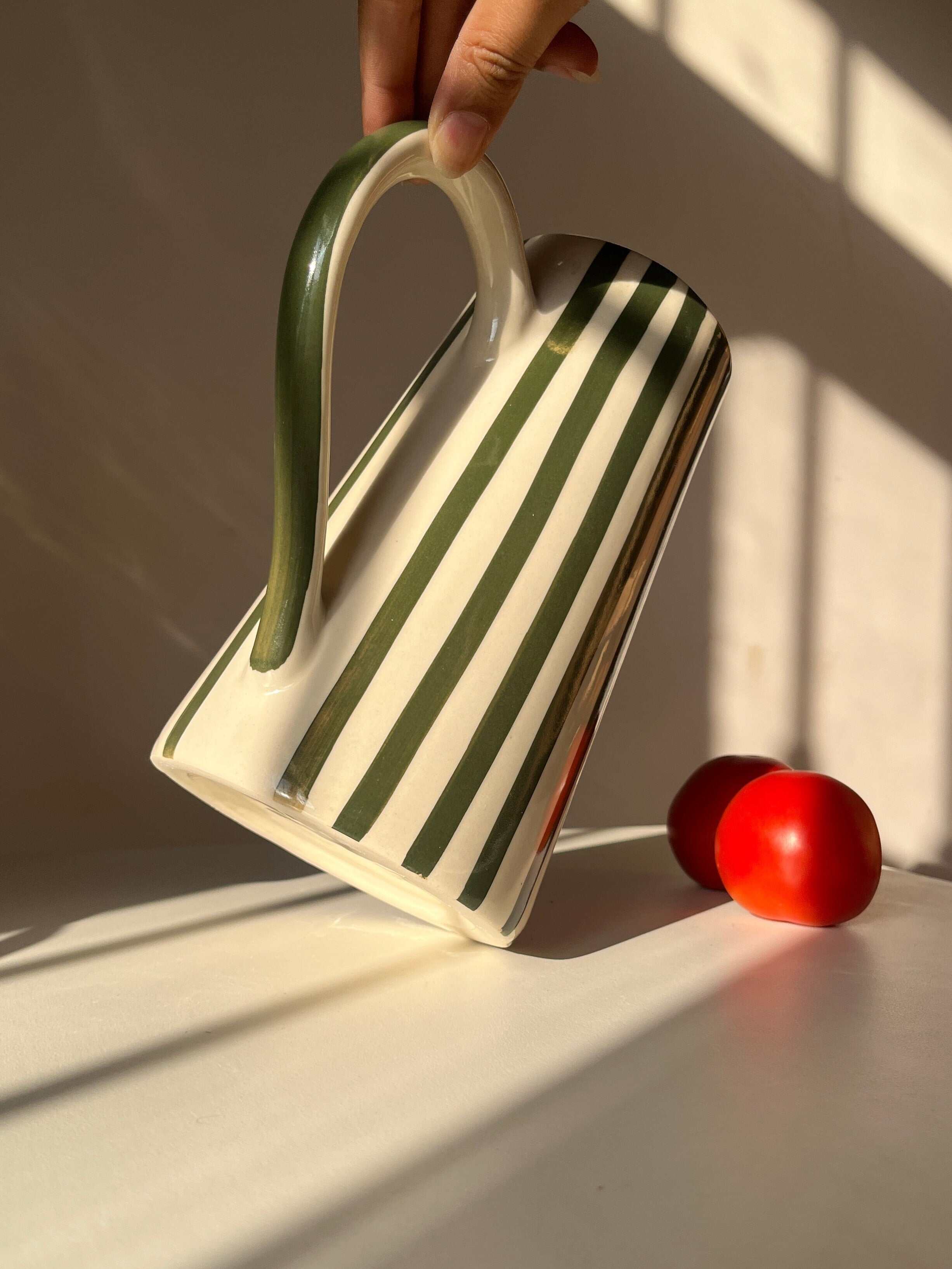 Tall ceramic jug vase with hand-painted striped design