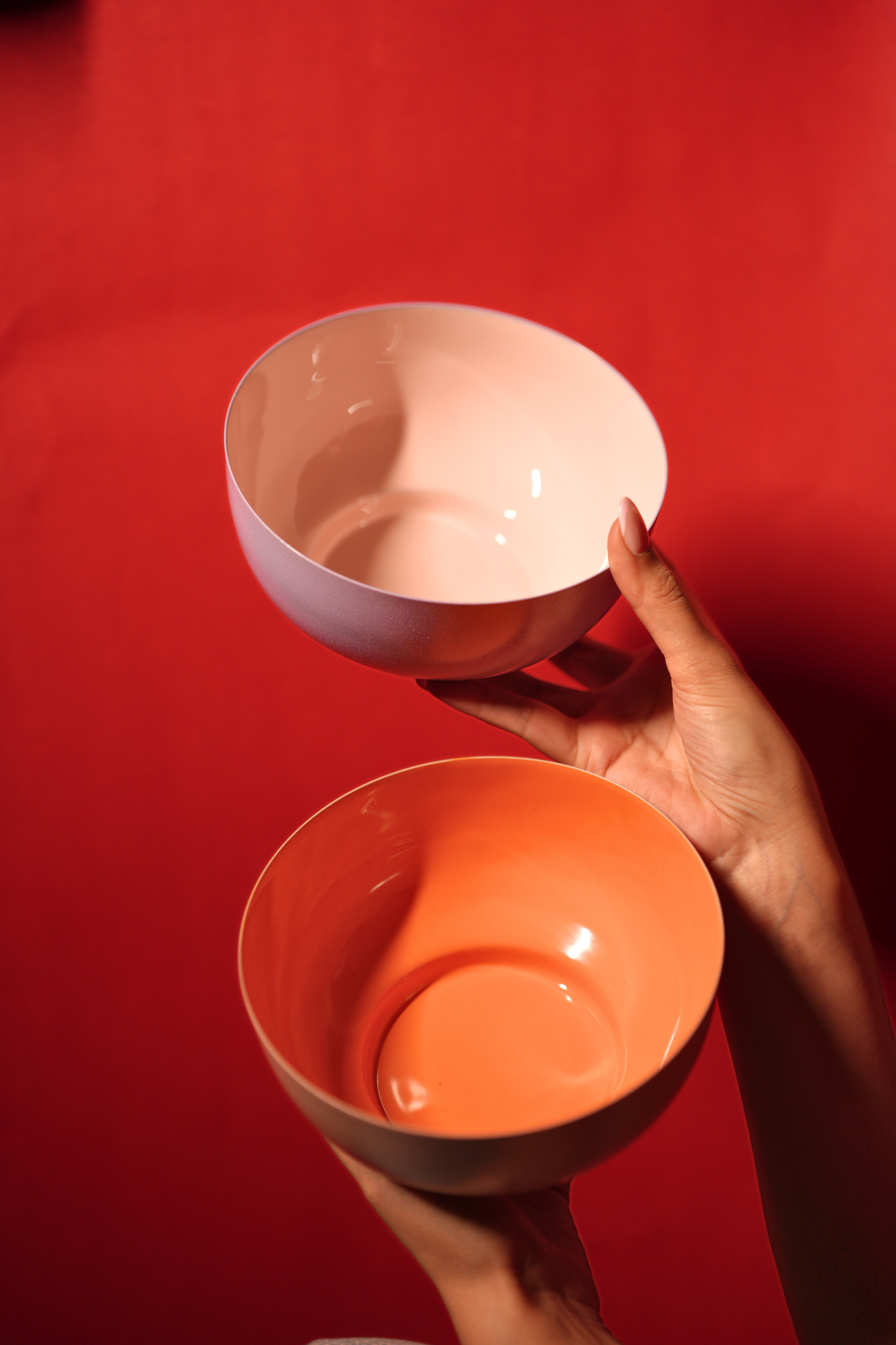 Bon Bon metal fruit bowl in orange and pink with enamel finish