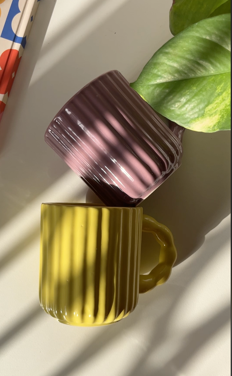 Sculptural fluted ceramic mug with glossy surface
