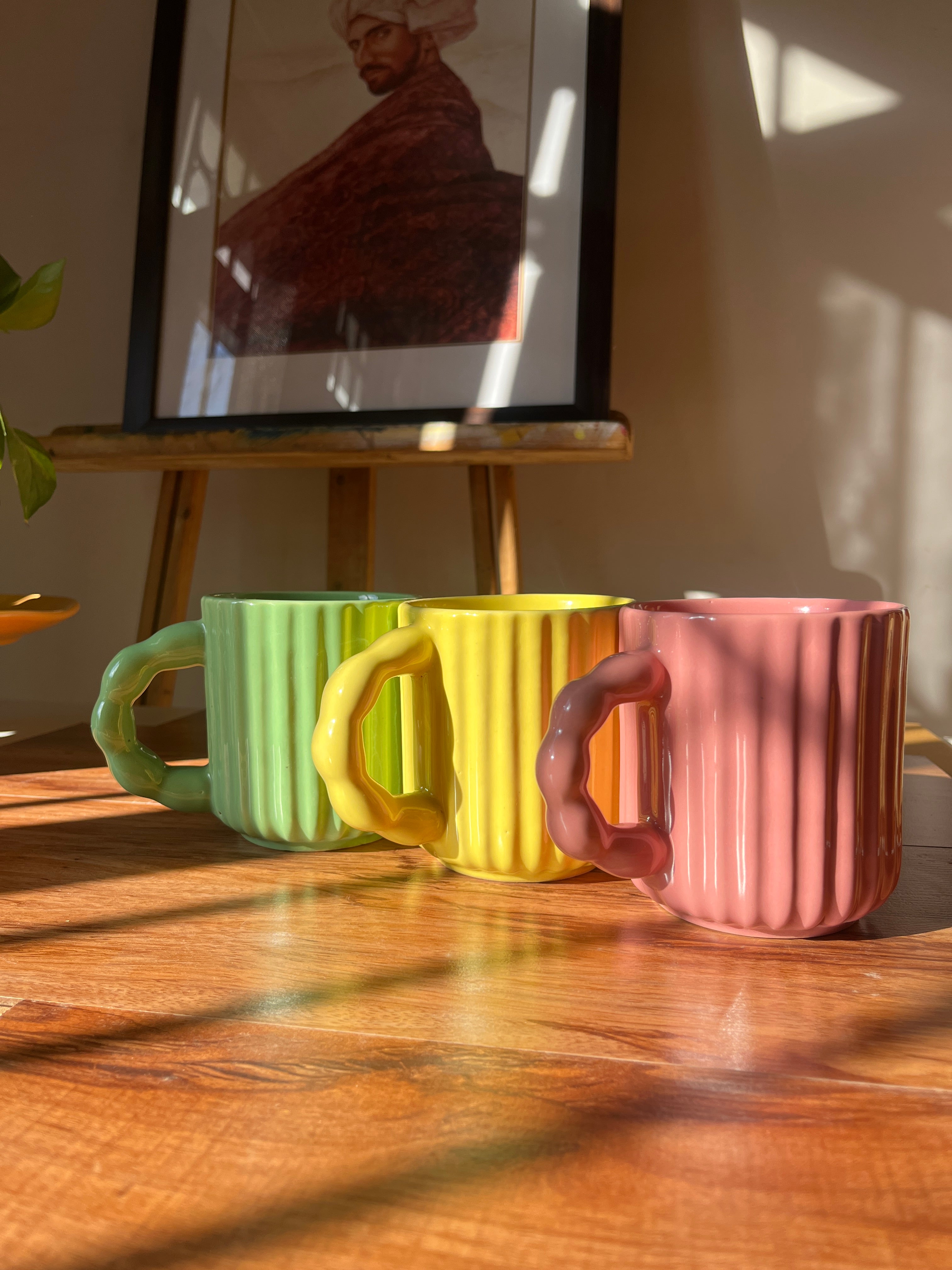 Chonky Sips mug trio featuring three fluted ceramic mugs in pink, yellow, and green.
