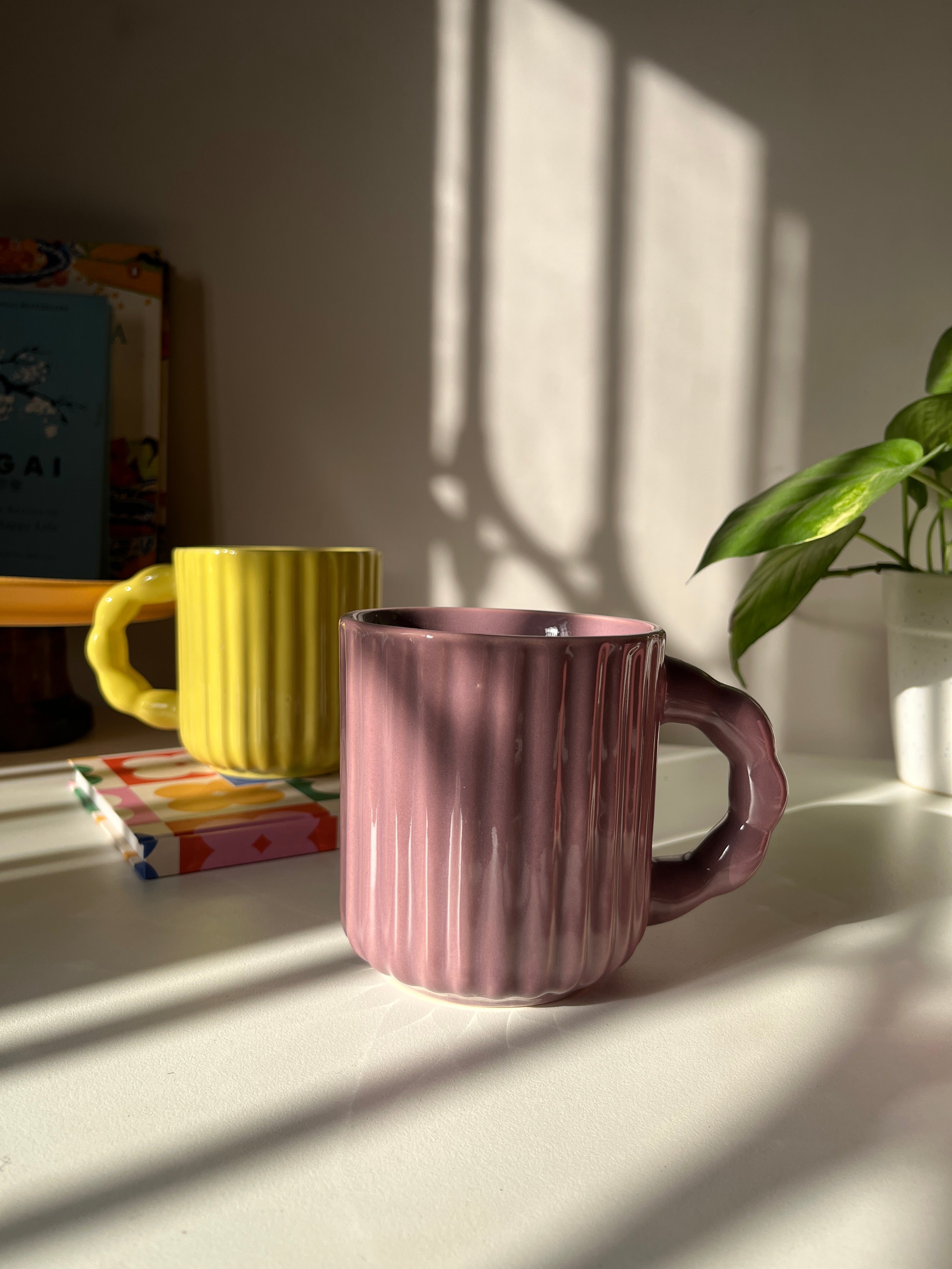 Handcrafted ceramic mug with fluted texture