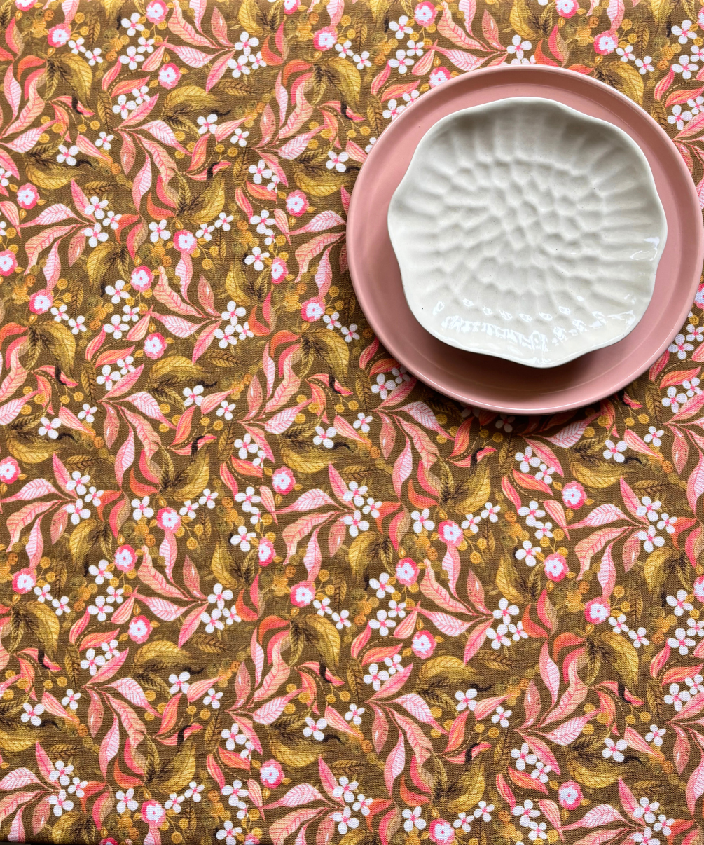 Decorative linen blend tablecover for 4 to 6 seater table styled with pink and white ceramic dishes