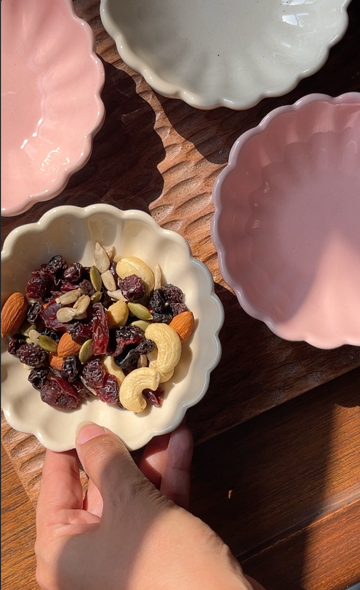 Loom & Bloom tray and bowl set styled on a dining table for serving snacks and desserts.