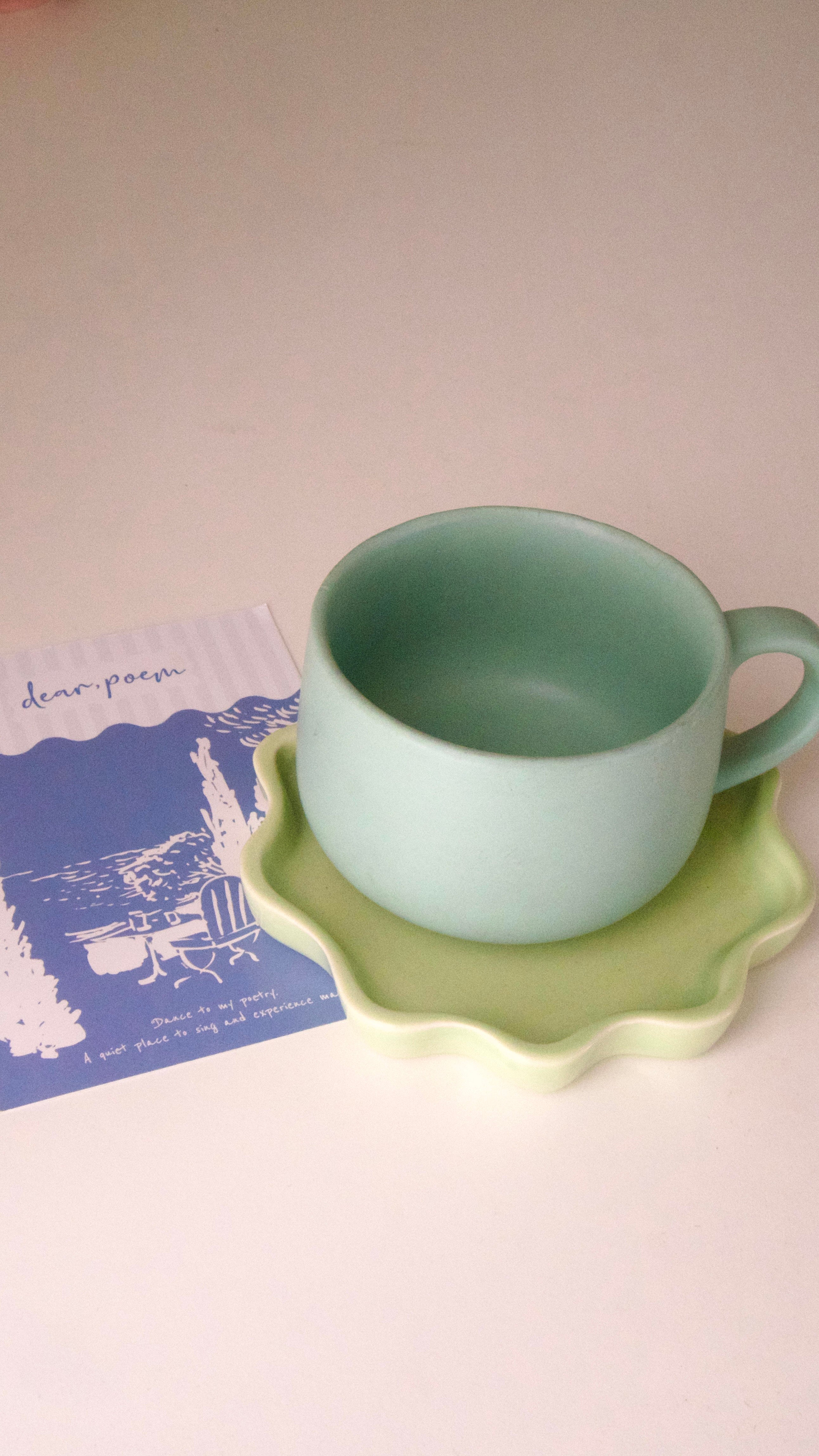 Modern ceramic tea cup in calming green hue