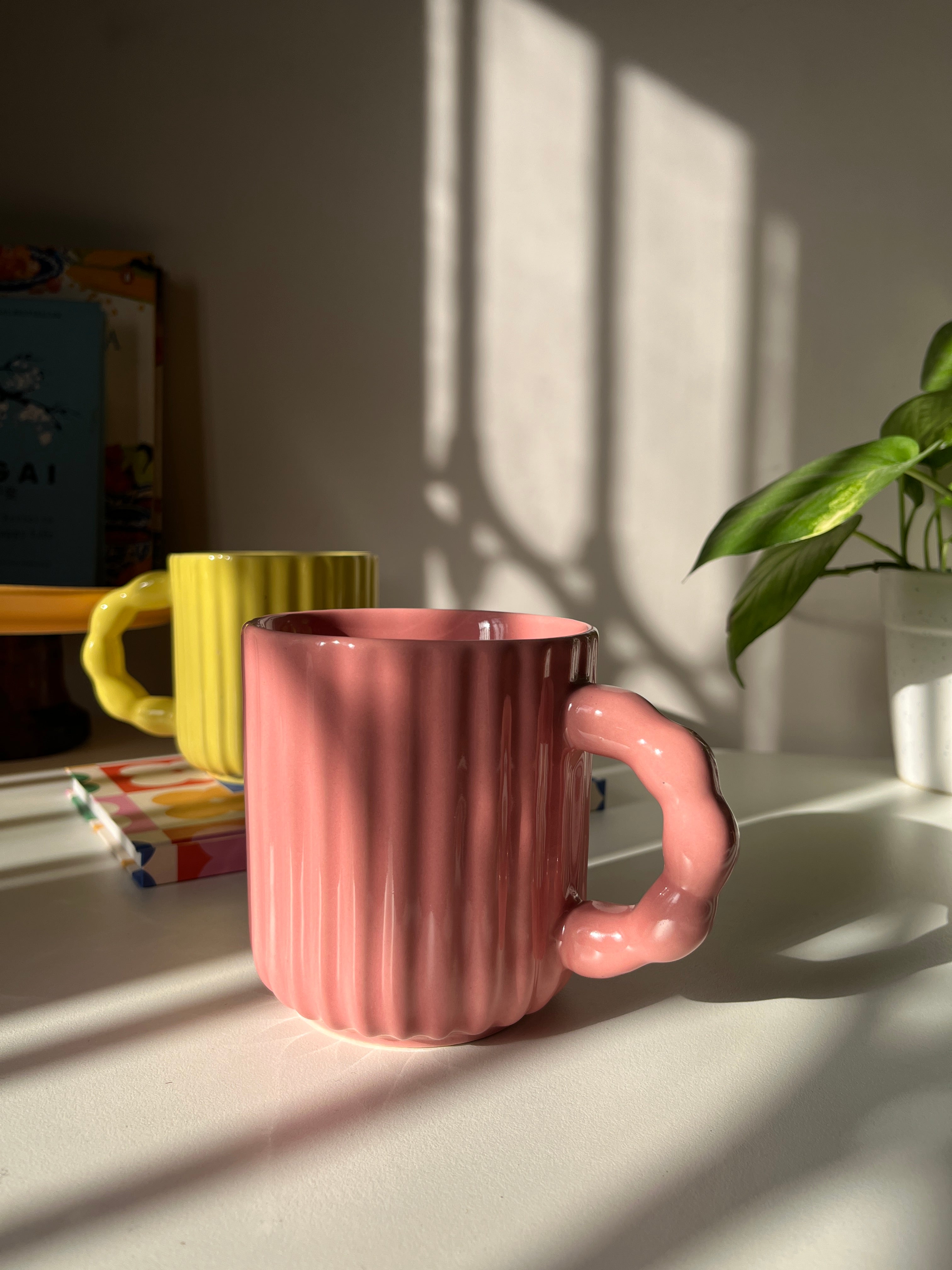 Modern ceramic mug with decorative beaded handle