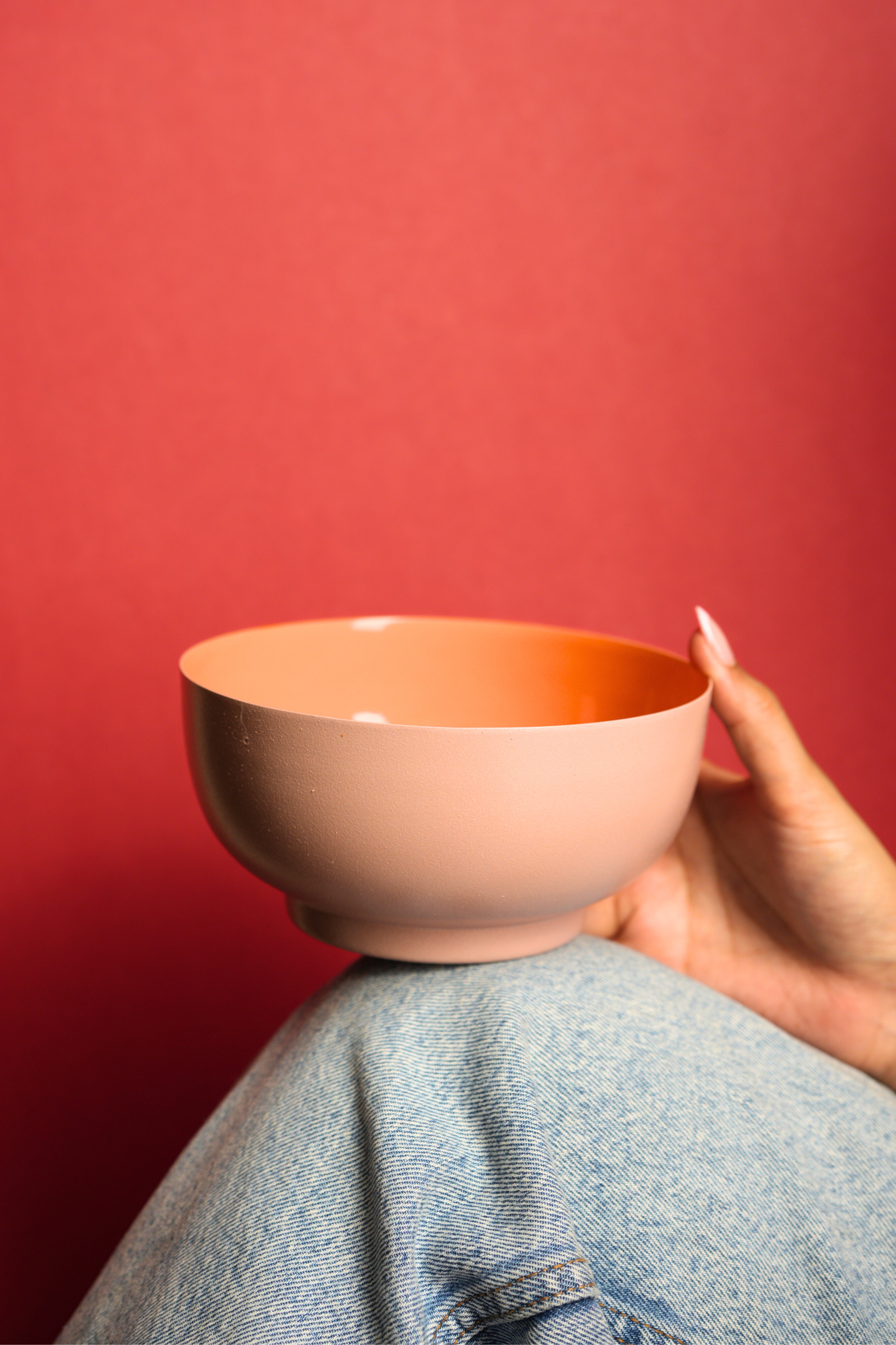 Contemporary Bon Bon metal bowl with textured exterior and glossy interior