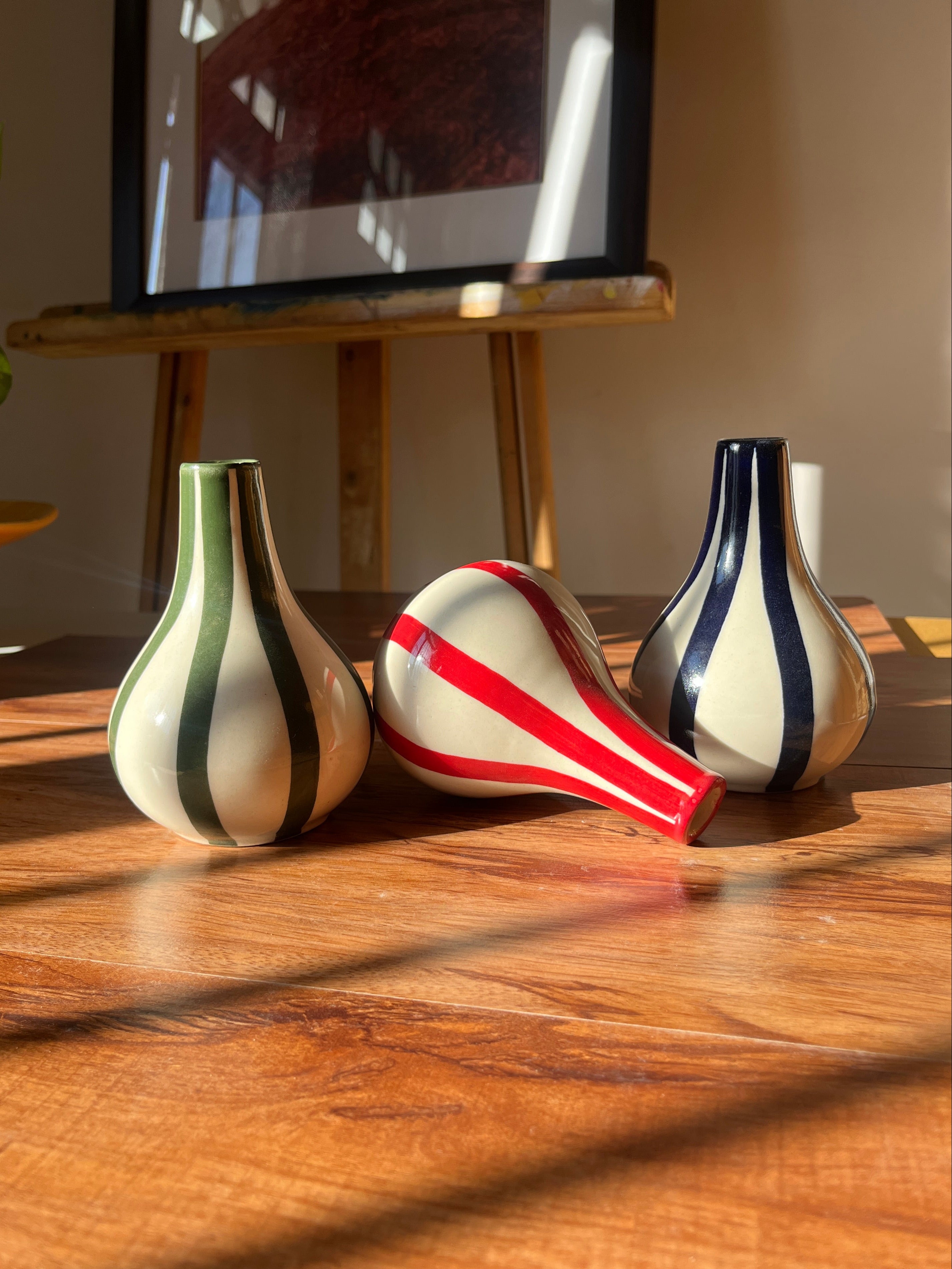 Set of three small striped flower vases designed for styling shelves and tables.