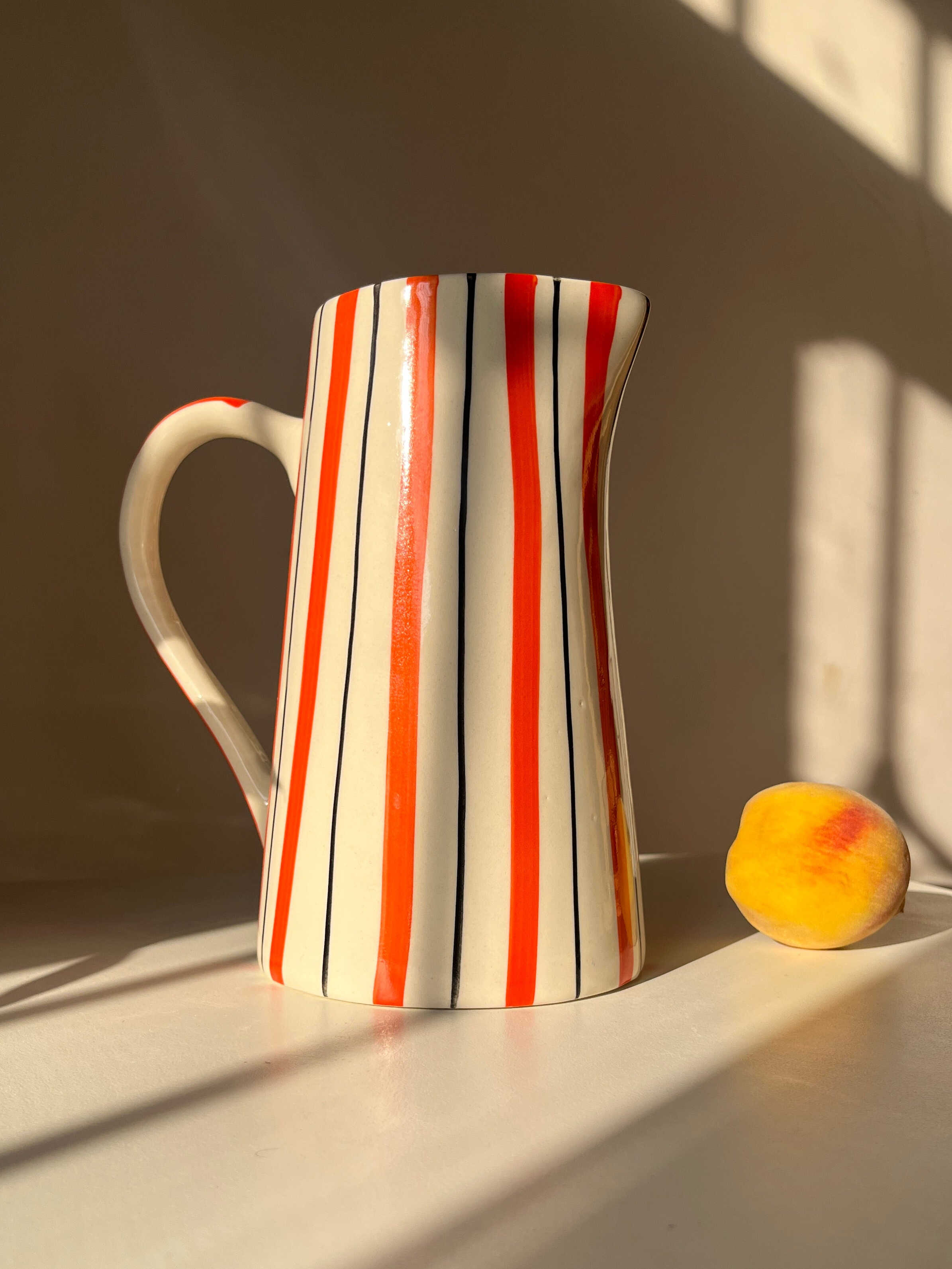 Ceramic jug vase with orange stripe detailing