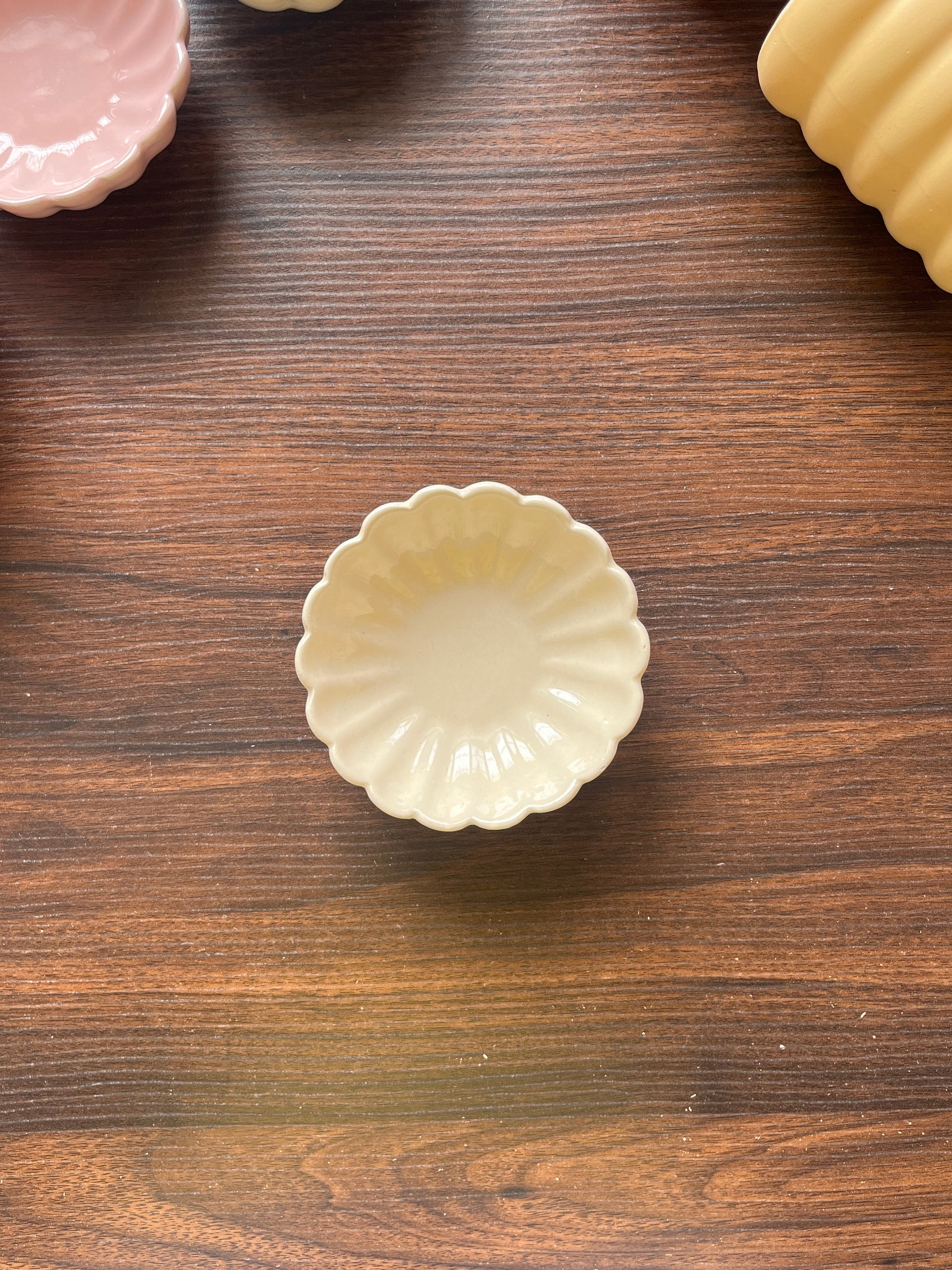 top shot of a white flower-shaped ceramic bowl with glossy finish